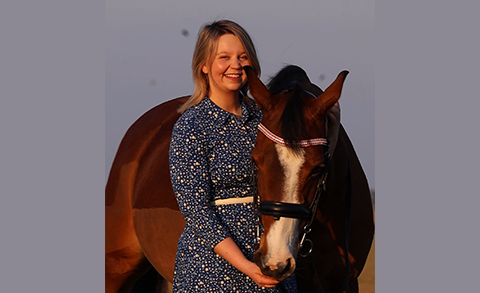 Lauren Day stood next to a horse
